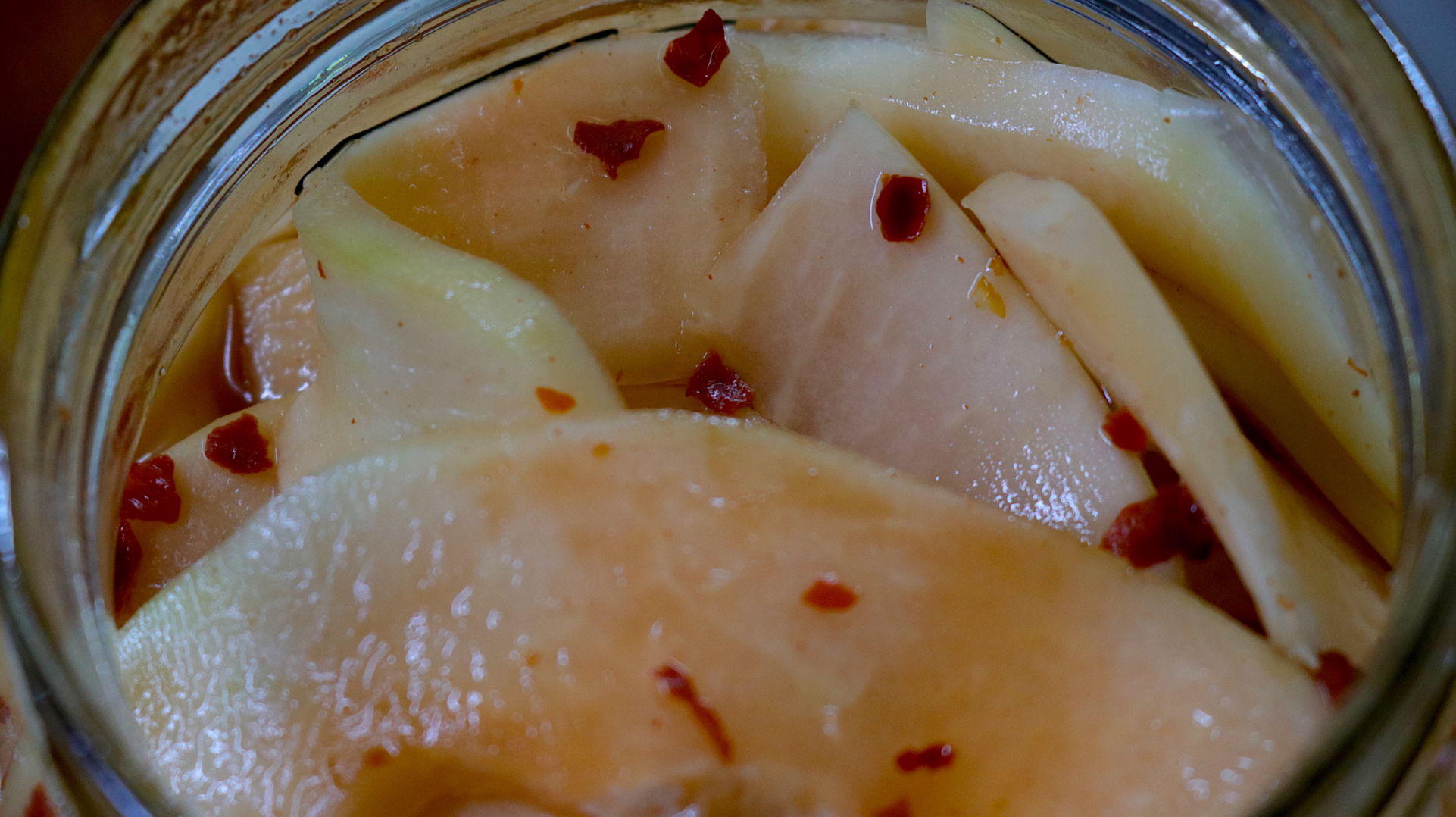 A jar full of pickled papaya
